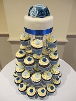 blue wedding cake and cupcakes